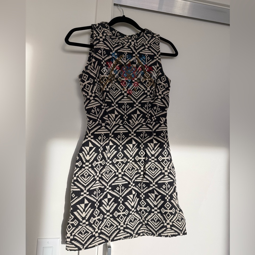 Cute summer dress with an open back. Size 2
